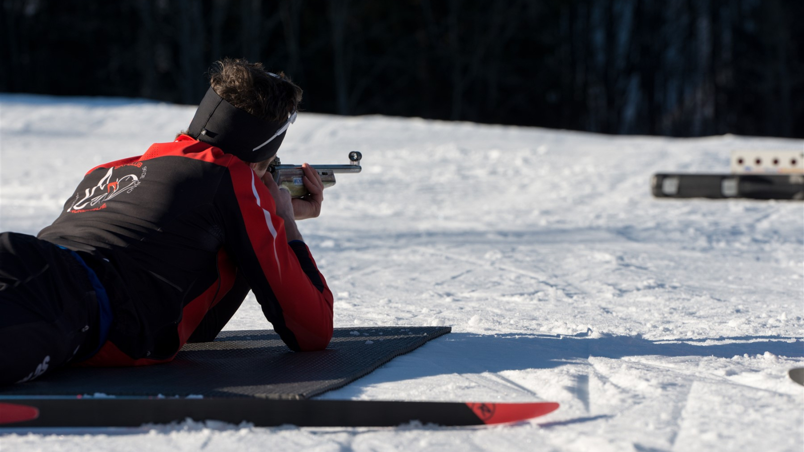 The shooter aims at the target