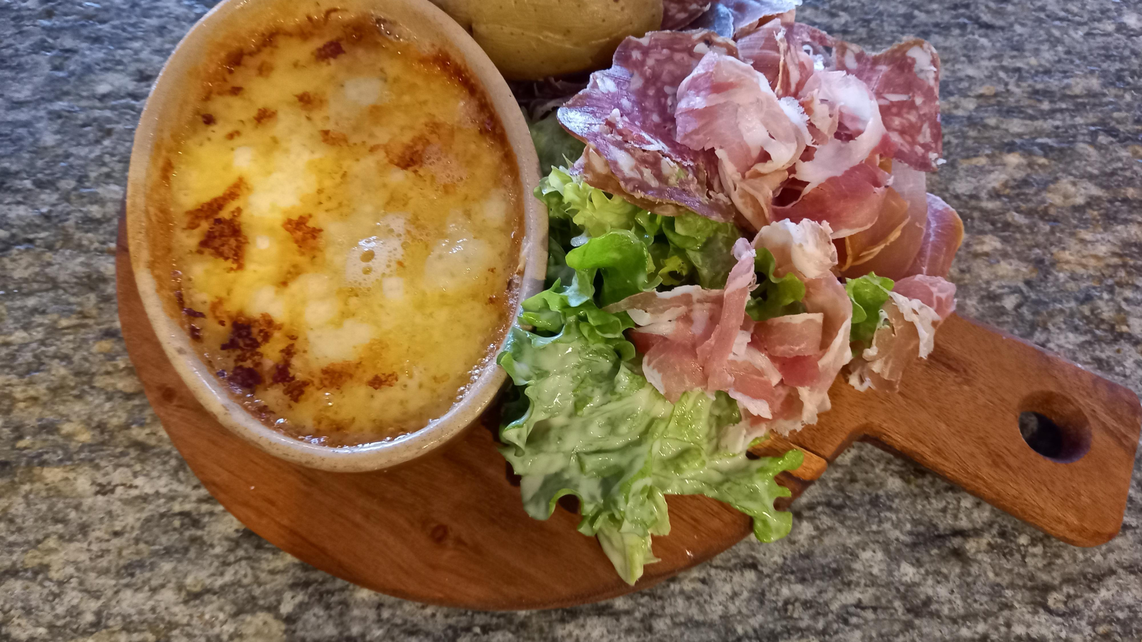 Individual raclette with cold cuts and salad