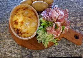 Individual raclette with cold cuts and salad