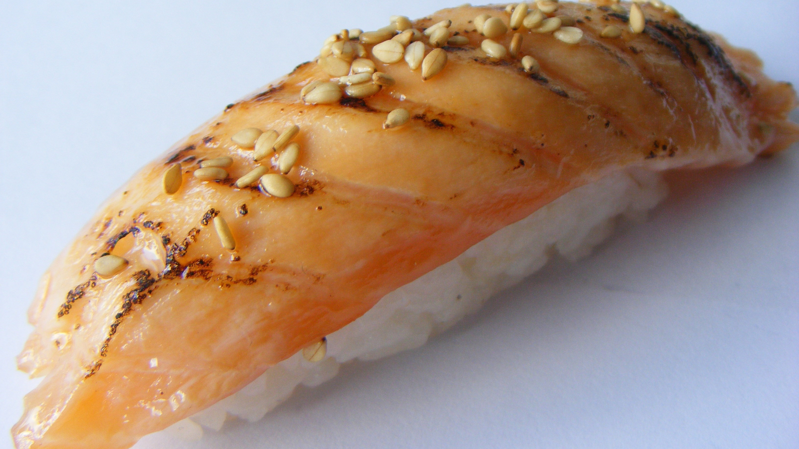 Seared salmon sushi with teriyaki sauce