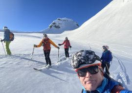 Guided downhill skiing trip with a group of four skiers