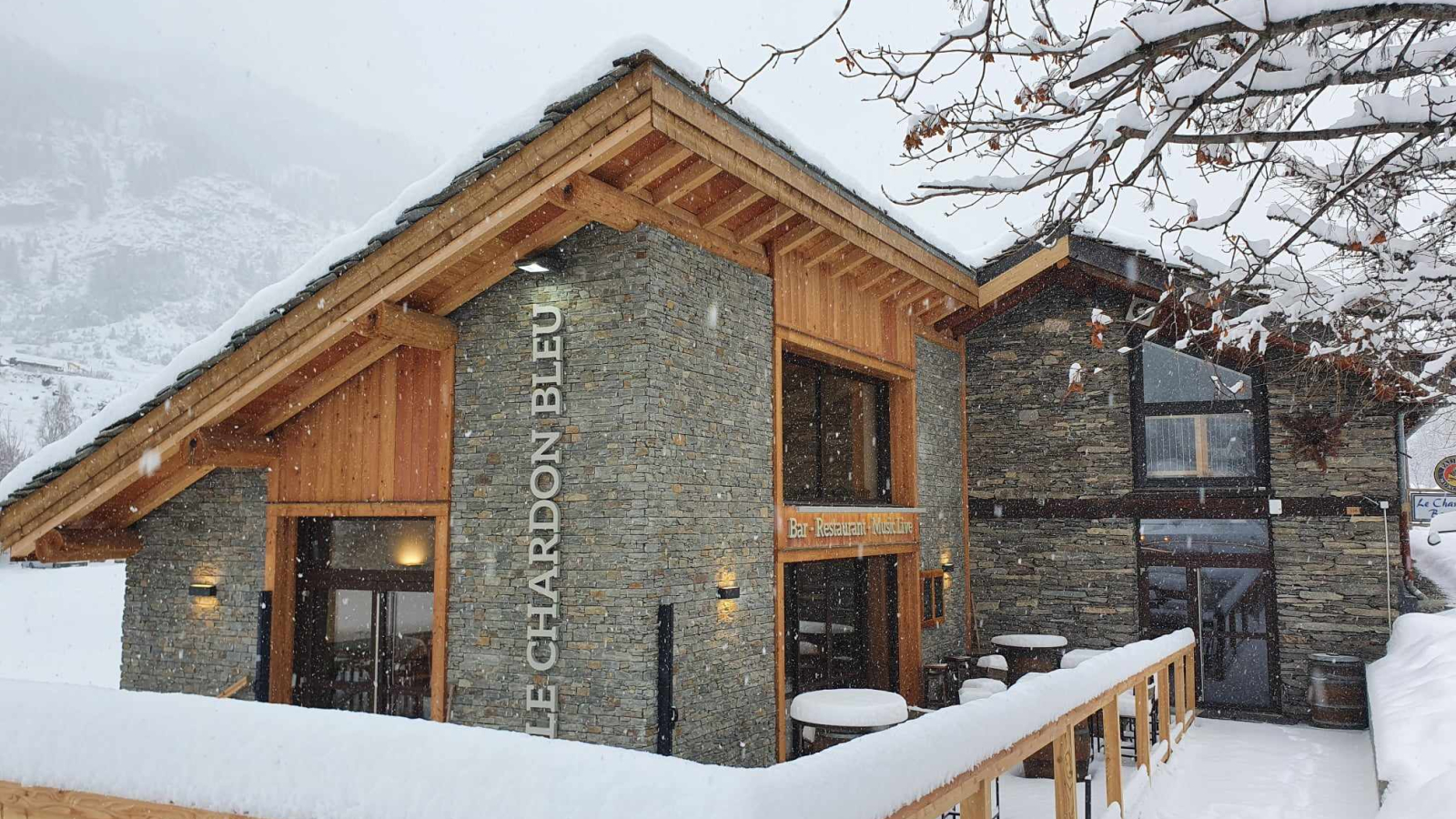 Snow-covered terrace of the Pub Le Chardon Bleu in Val Cenis