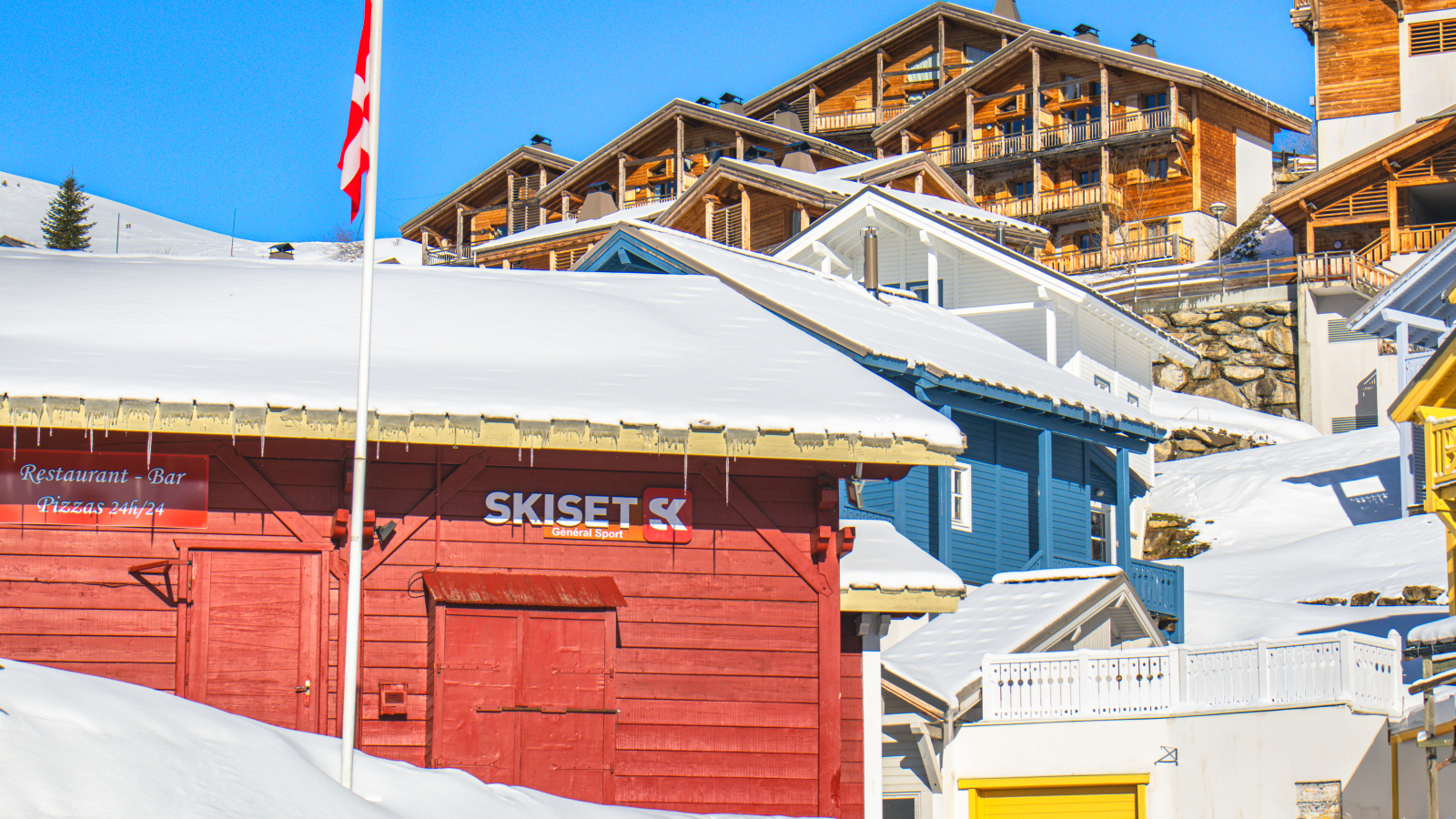 Side of the General Sport shop with Dormio Resort in the background