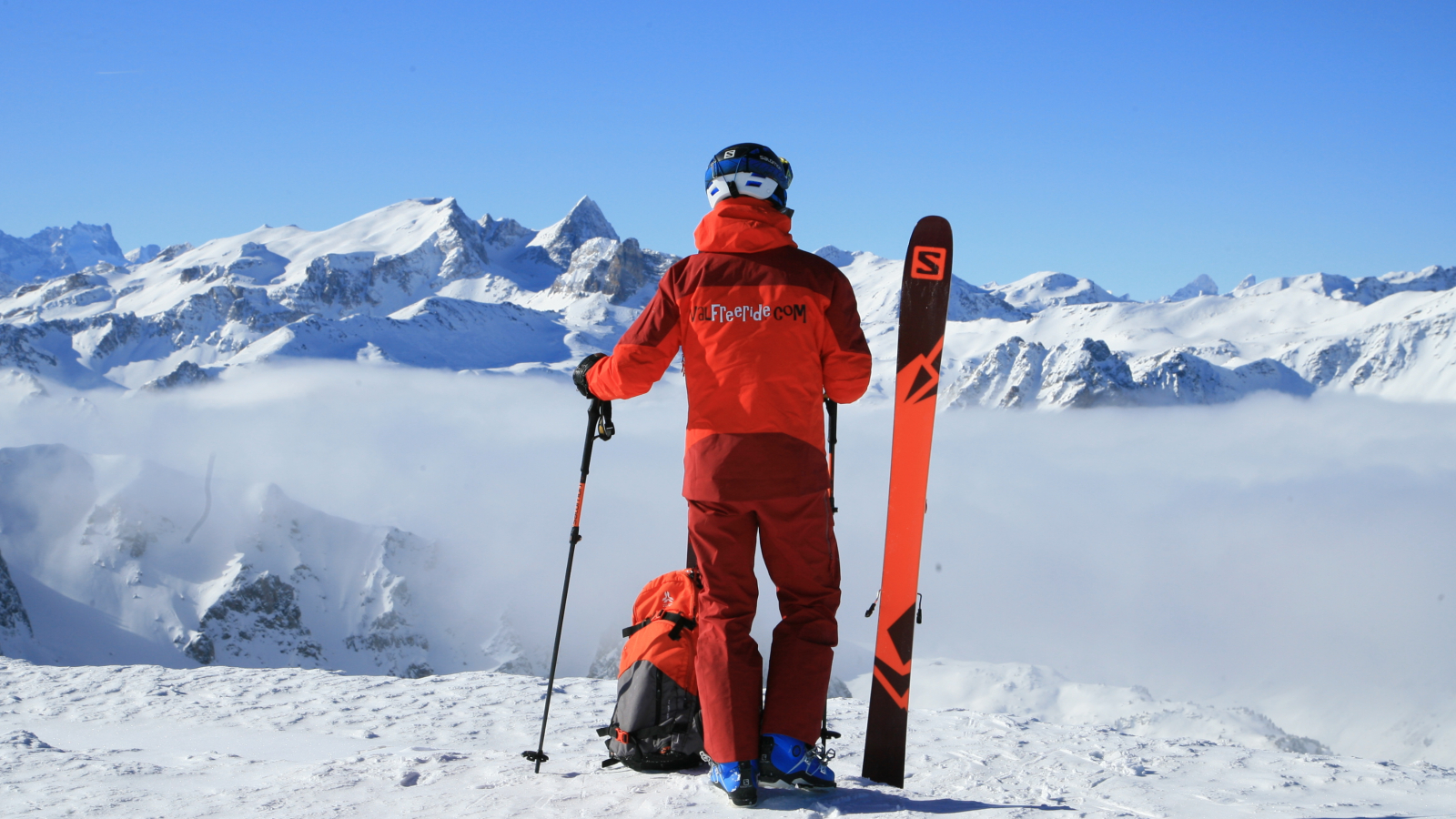 Ski instructor looking out over the snow-capped peaks of Valfréjus