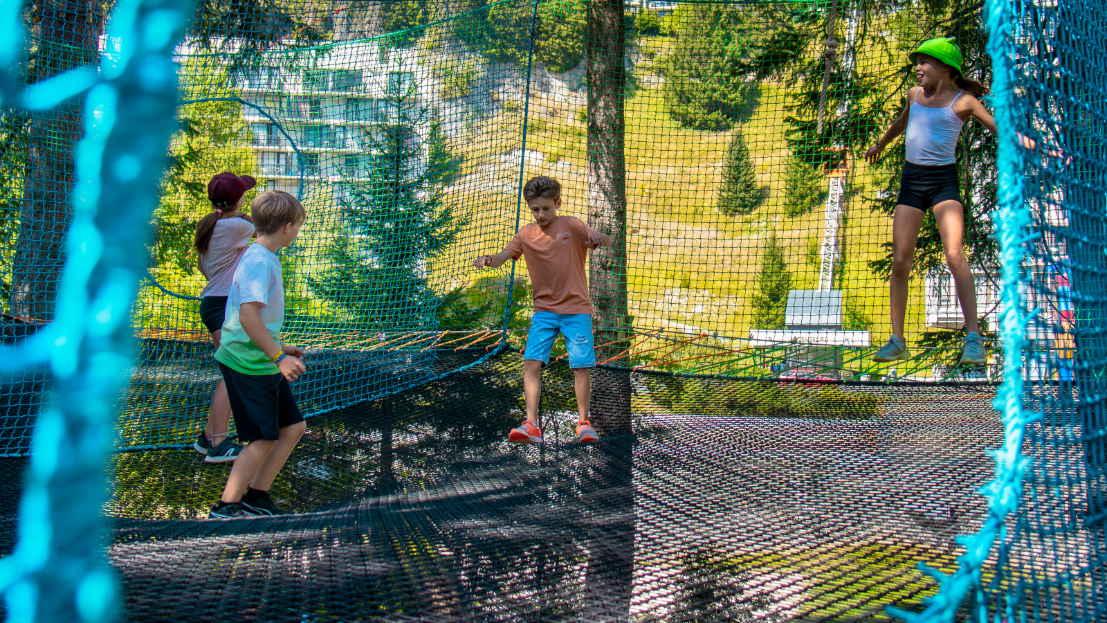 Group of children playing in the middle section of the accro-fun