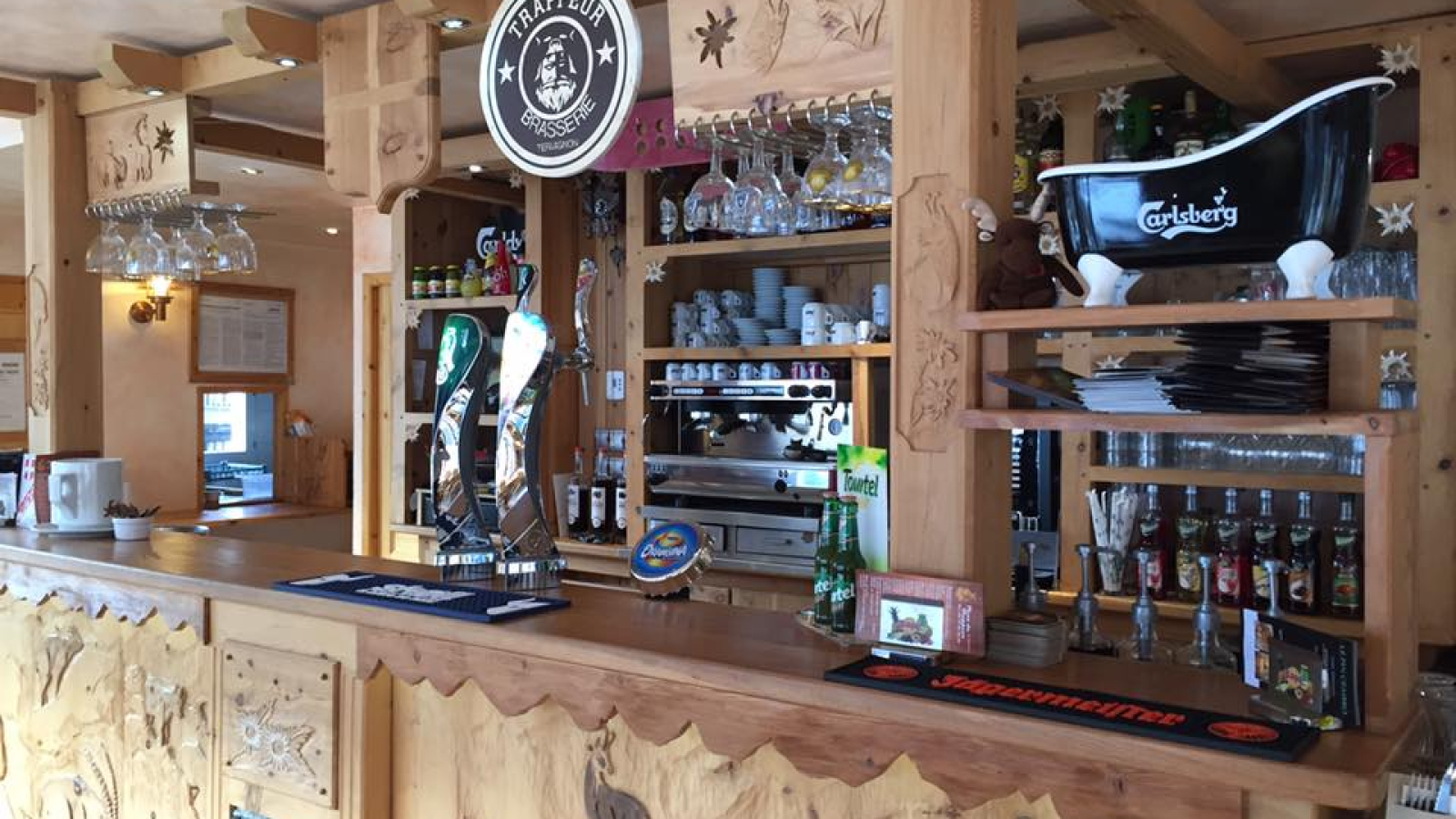 The bar, in carved wood